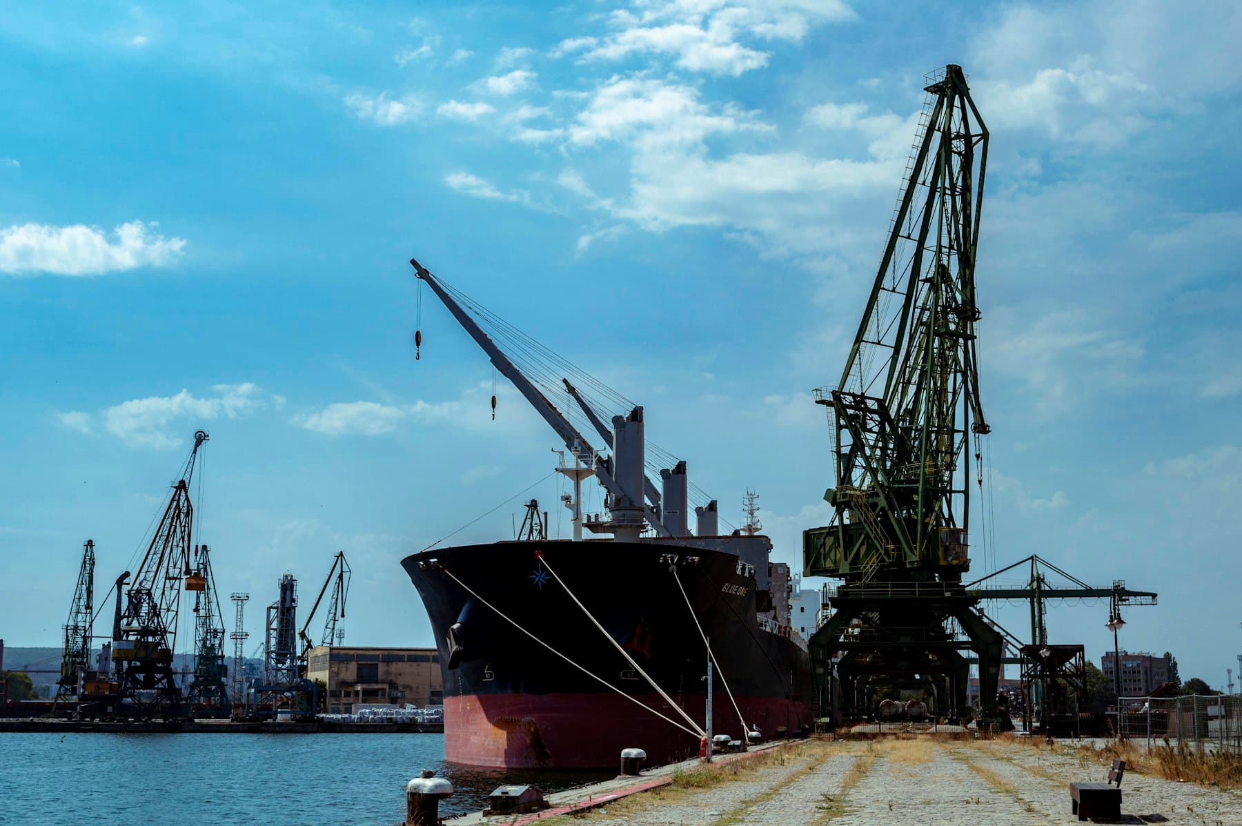Cargo ship and cranes at the port of Varna